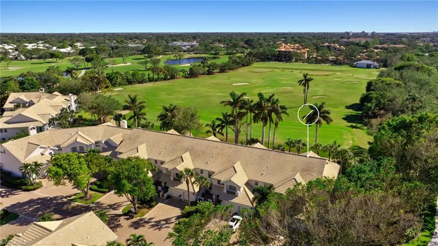 Drone / aerial view of a large body of water and a local golf course
