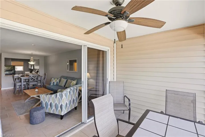View of patio featuring an outdoor hangout area, a ceiling fan, and outdoor dining area