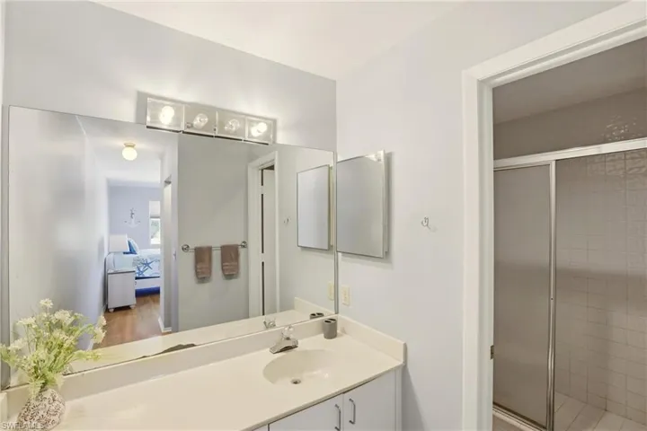 Ensuite bathroom with vanity and a stall shower