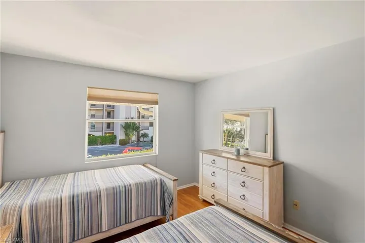 Bedroom with baseboards and light wood-style floors