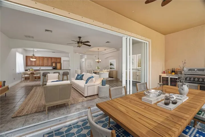 VIRTUALLY STAGED IWHT FURNITURE. LANAI / LIVING ROOM OPENED UP FOR INDOOR / OUTDOOR LIVING