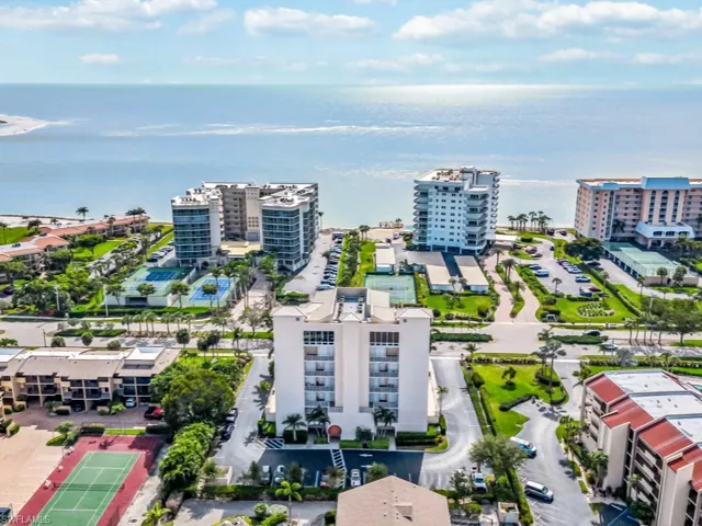 Drone / aerial view with a water view and a city view