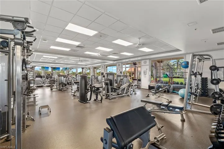 Exercise room with plenty of natural light and a paneled ceiling