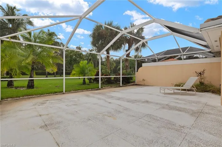 View of patio with a lanai
