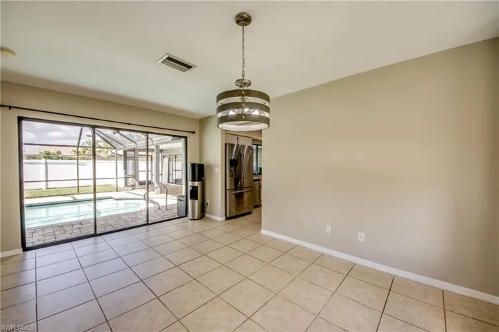 Spare room featuring light tile patterned floors and a sunroom