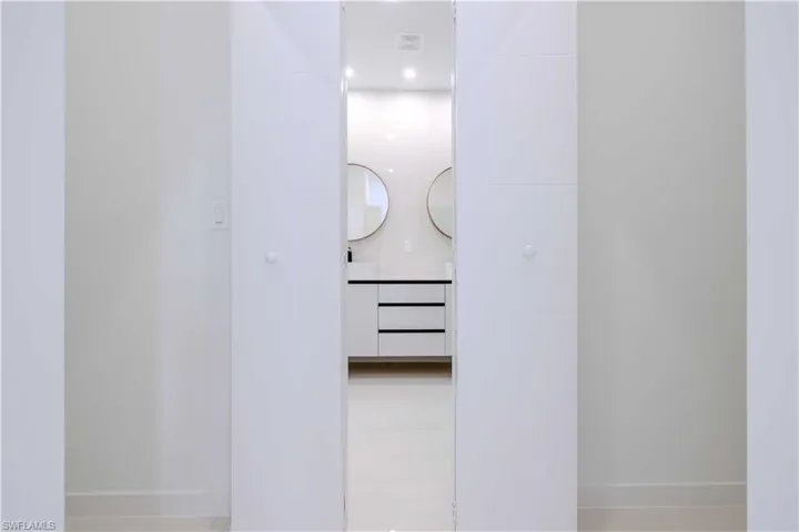 Hallway featuring baseboards