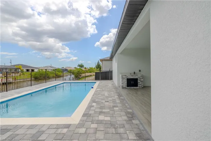 View of pool featuring a patio area and a residential view