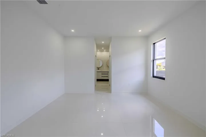 Spare room with tile patterned flooring and recessed lighting