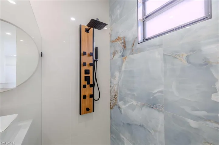 Bathroom featuring tiled shower