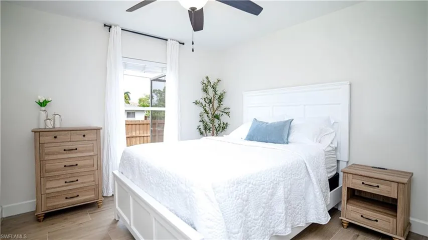 Bedroom with light wood-style flooring and ceiling fan