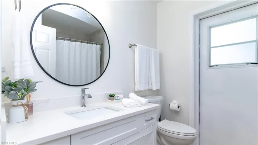 Full bathroom featuring vanity and a shower with curtain