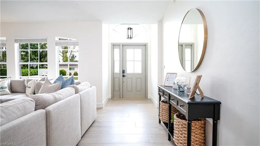 Entrance foyer featuring light wood-type flooring and baseboards