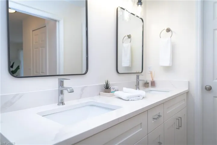 Bathroom featuring double vanity