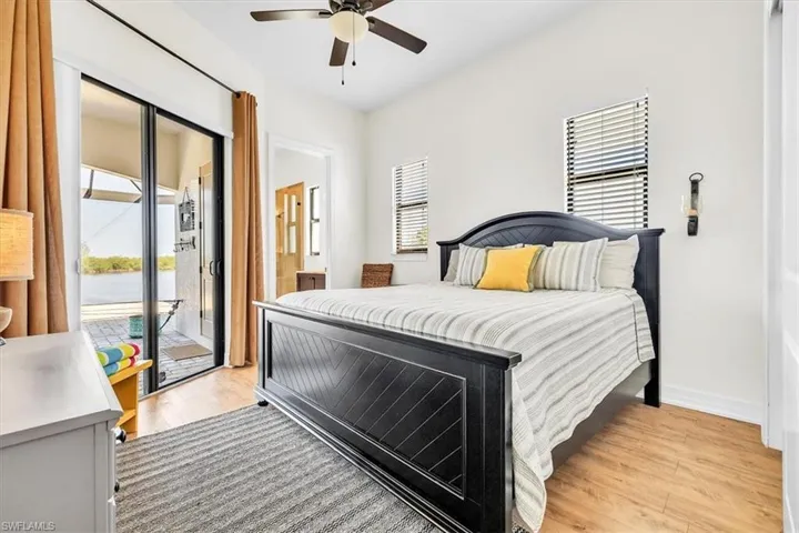 Bedroom featuring wood-finish flooring and a ceiling fan