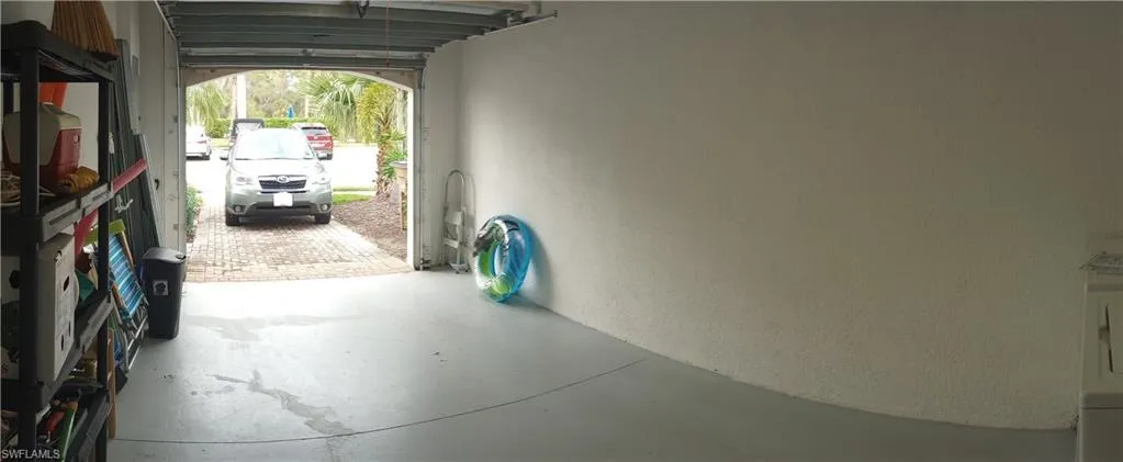 Garage with finished floor to paved driveway