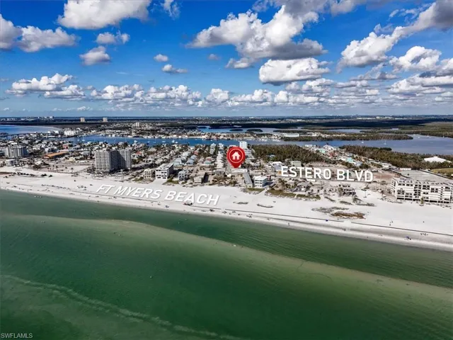 Aerial view with a view of the beach and a water view
