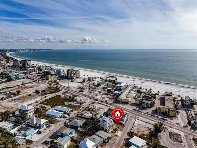 Bird's eye view with a view of the beach and a water view