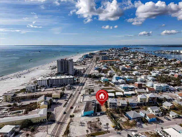 Bird's eye view featuring a view of the beach and a water view
