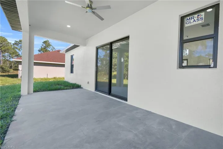 View of patio with a ceiling fan