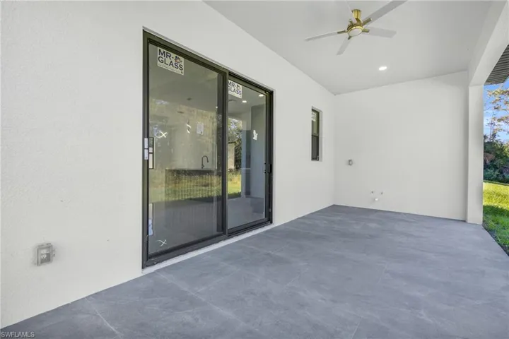 View of patio featuring a ceiling fan