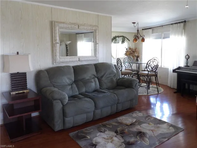 Living room with hardwood / wood-style floors