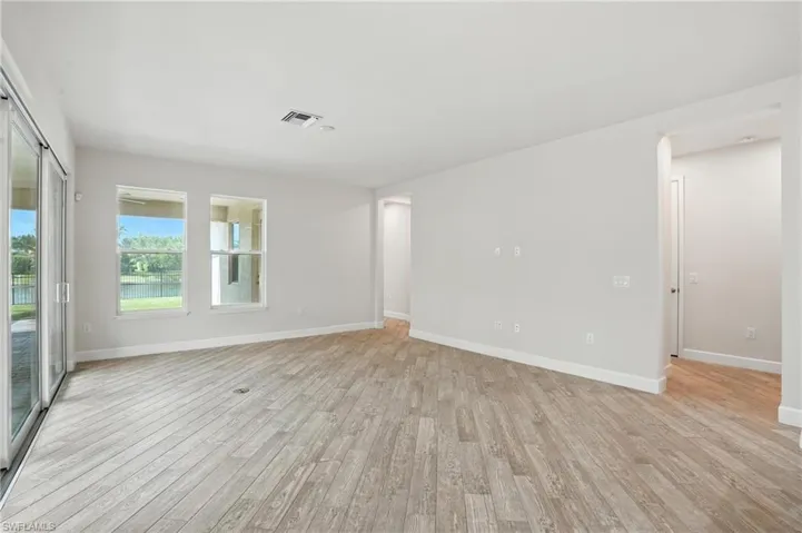 Unfurnished room with light wood finished floors
