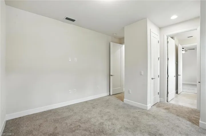 Unfurnished bedroom featuring carpet floors and recessed lighting
