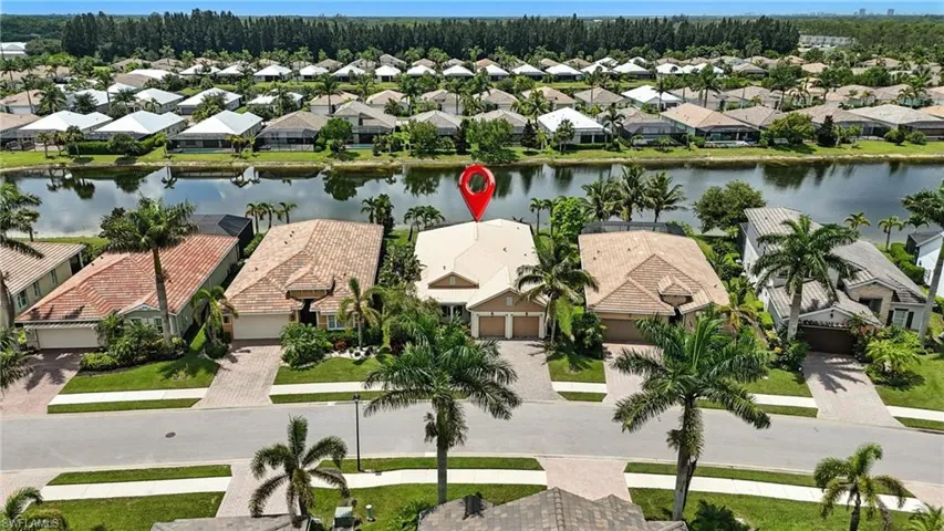 Aerial perspective of suburban area with a large body of water