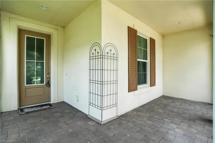 View of exterior entry with stucco siding