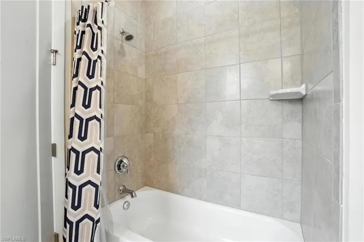 Full bathroom with shower / bath combo