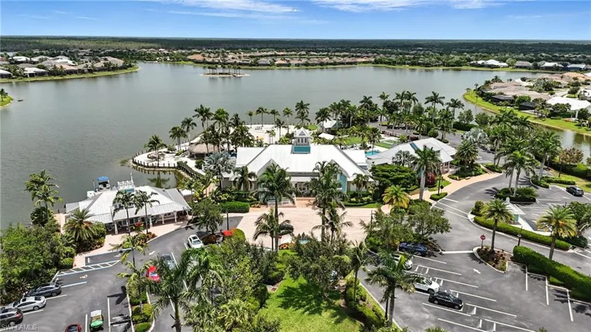 View of property location with a nearby body of water and nearby suburban area