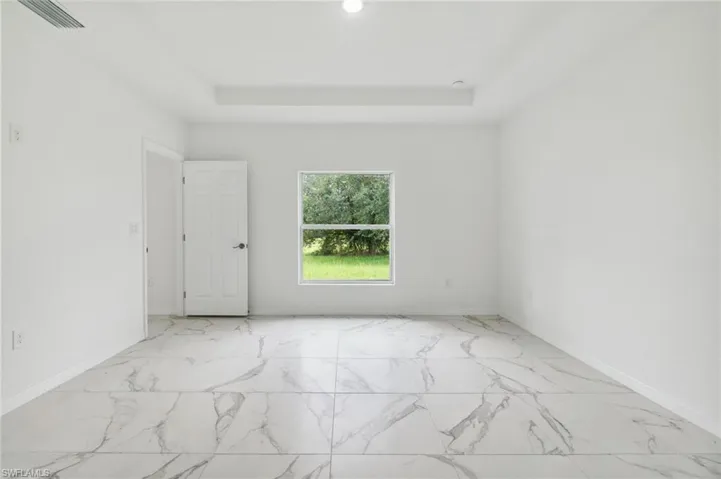 Empty room with a raised ceiling