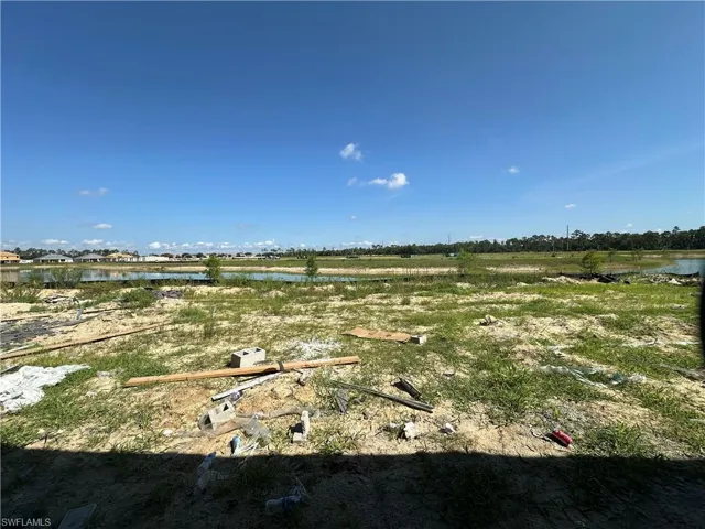 View of yard with a water view
