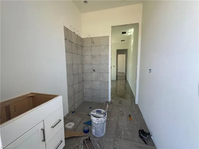 Bathroom featuring tiled shower