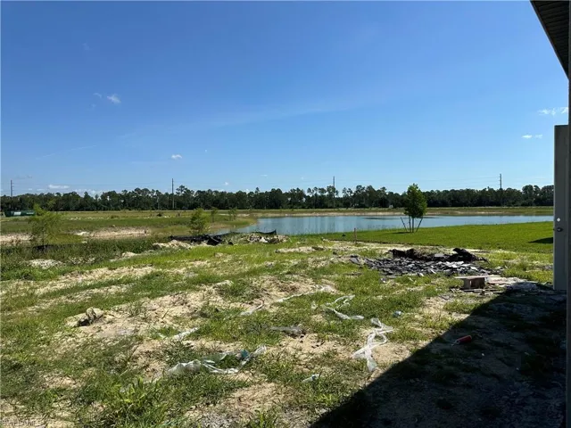 View of yard with a water view