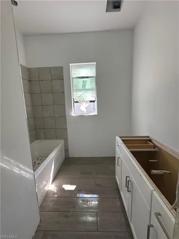 Bathroom featuring tile floors