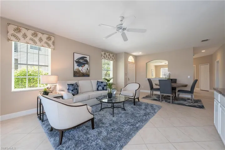 Tiled living room with ceiling fan