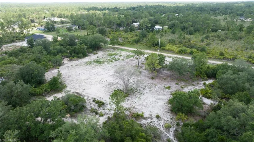 View of property location with a forest