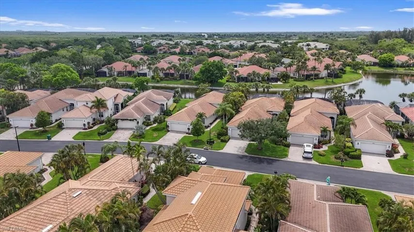 Aerial perspective of suburban area with a nearby body of water