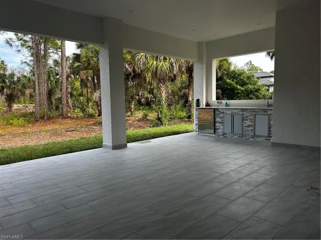 View of patio with exterior kitchen