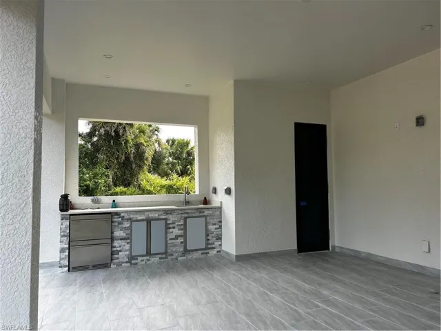 View of patio / terrace featuring area for grilling and a sink