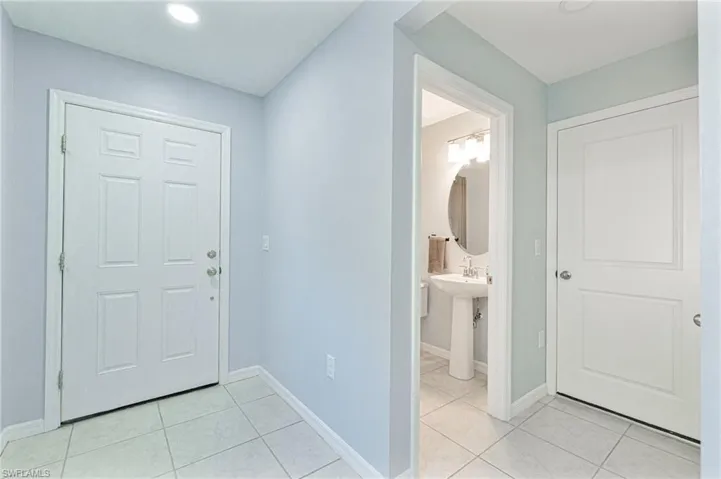 Tiled entryway with sink