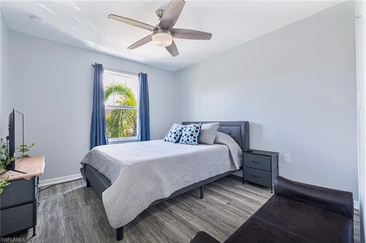 Bedroom featuring hardwood / wood-style flooring and ceiling fan