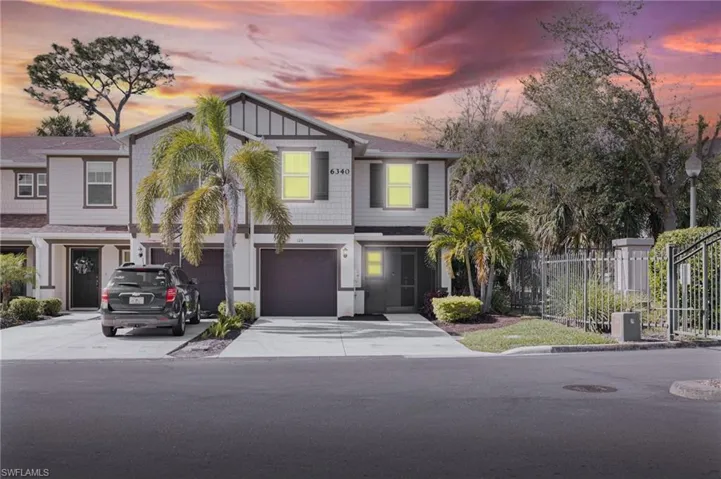 View of front of property with a garage