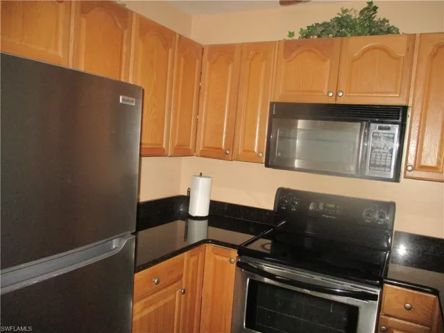 Kitchen with appliances with stainless steel finishes