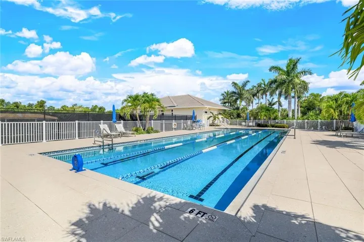 Community pool featuring a patio