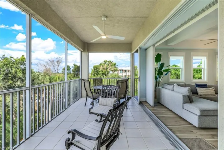 Balcony featuring a ceiling fan and outdoor lounge area
