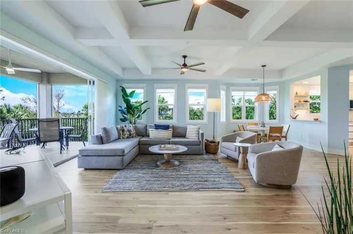 Sunroom / solarium featuring beamed ceiling and coffered ceiling