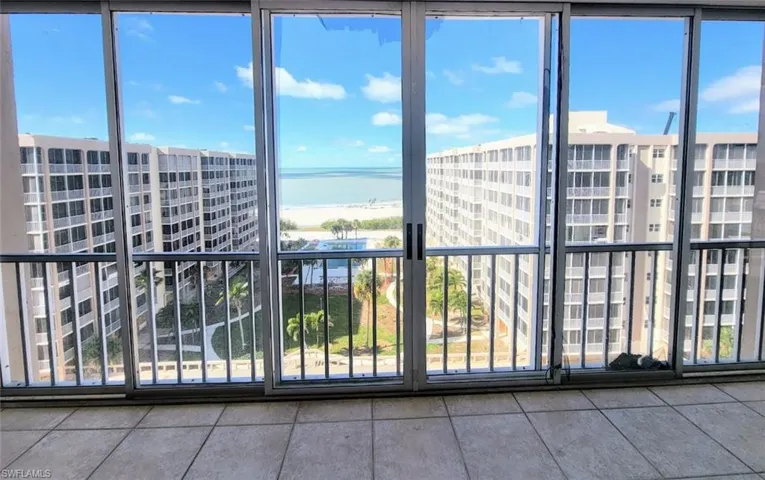 View of Beach from Living Room through Sliders