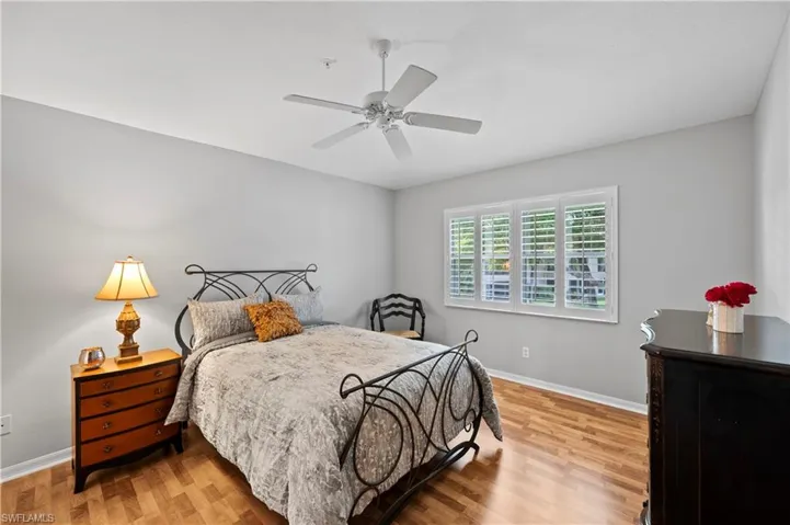 Bedroom featuring wood finished floors and a ceiling fan